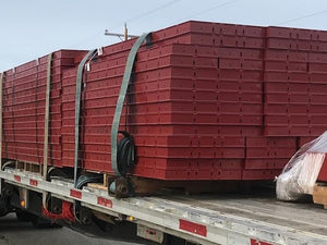 Truck hauling construction equipment.